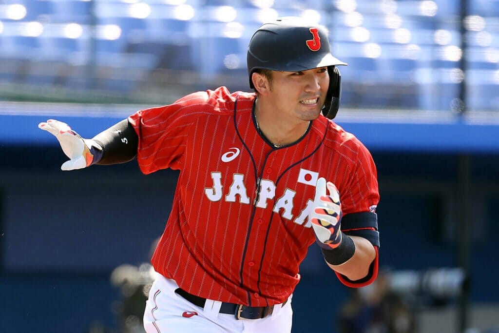 YOKOHAMA, JAPAN - JULY 31: Seiya Suzuki #51 of Team Japan tosses his bat aside on his way to first base in the ninth inning against Team Mexico during the baseball opening round Group A game on day eight of the Tokyo 2020 Olympic Games at Yokohama Baseball Stadium on July 31, 2021 in Yokohama, Kanagawa, Japan. (Photo by Koji Watanabe/Getty Images)