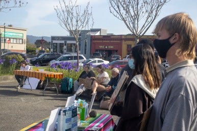 Photo by Carlos Pedraza | Gathered crowd looks on during the speech at the Arcata Plaza on April 7.