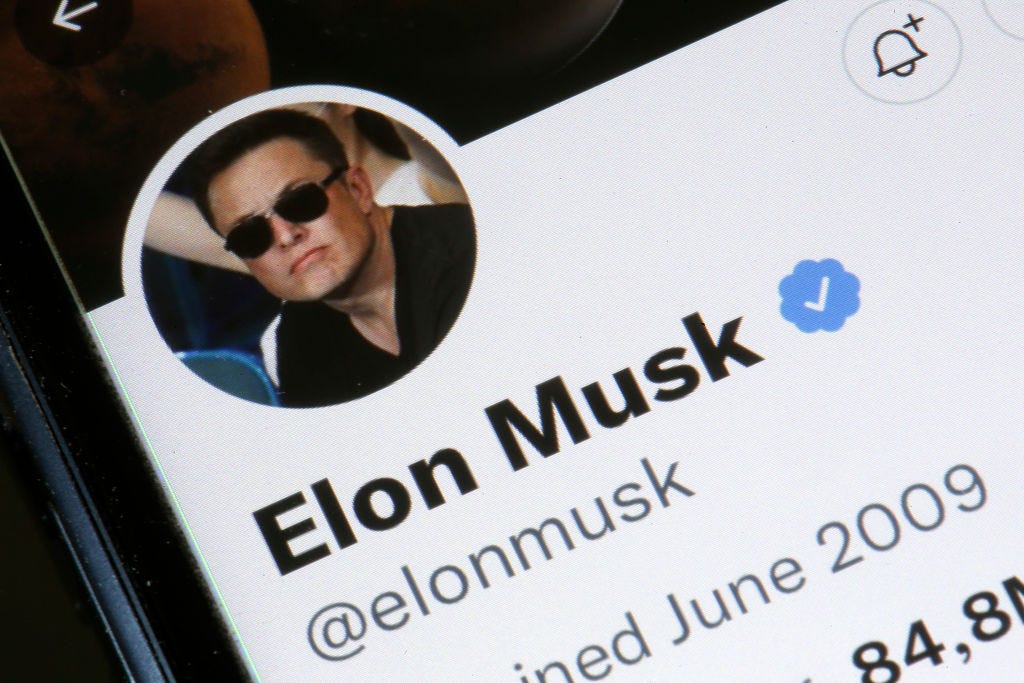 Photo of Elon Musk's Twitter profile on a smartphone. (Photo illustration by Chesnot/Getty Images)