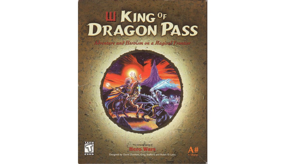 Software box with title "King of Dragon Pass" and a circular artwork showing two magic-wielding warriors on horseback in front of a jagged purple mountain and a red-hued sky.