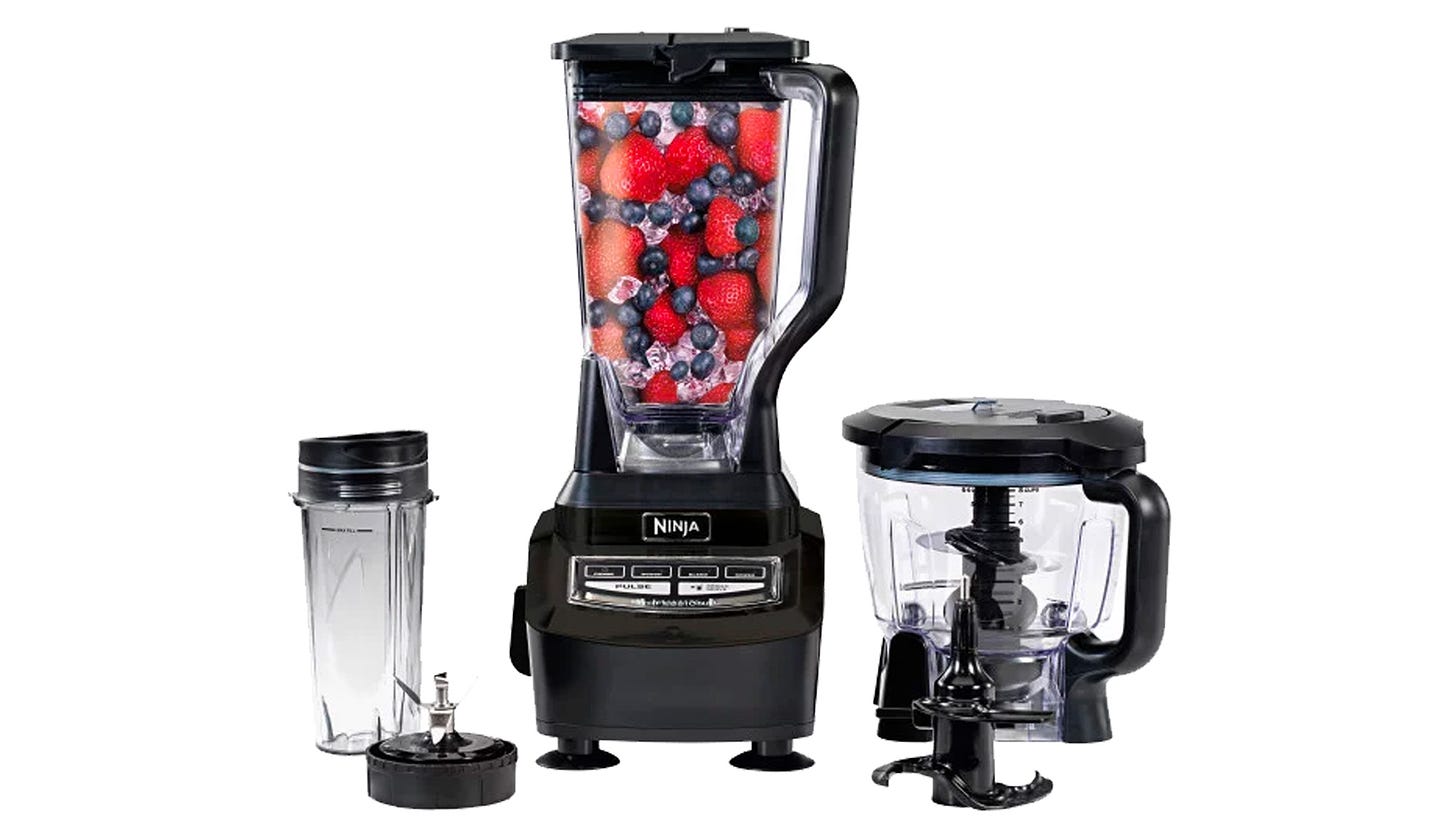 The Ninja Supra with blender cup, food processor bowl, and accessories on a white background