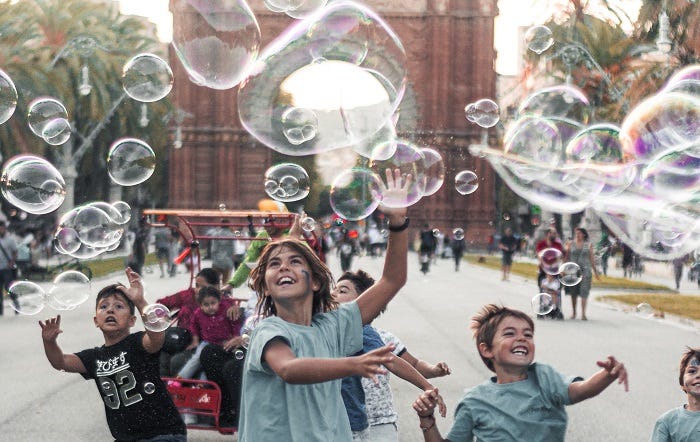 kids playing with bubbles