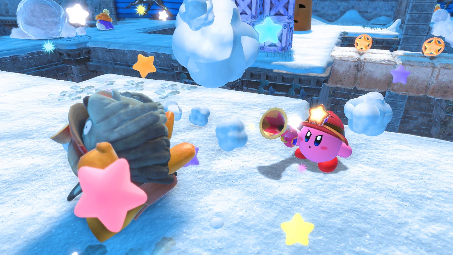 Kirby firing at an enemy in a snow-covered level
