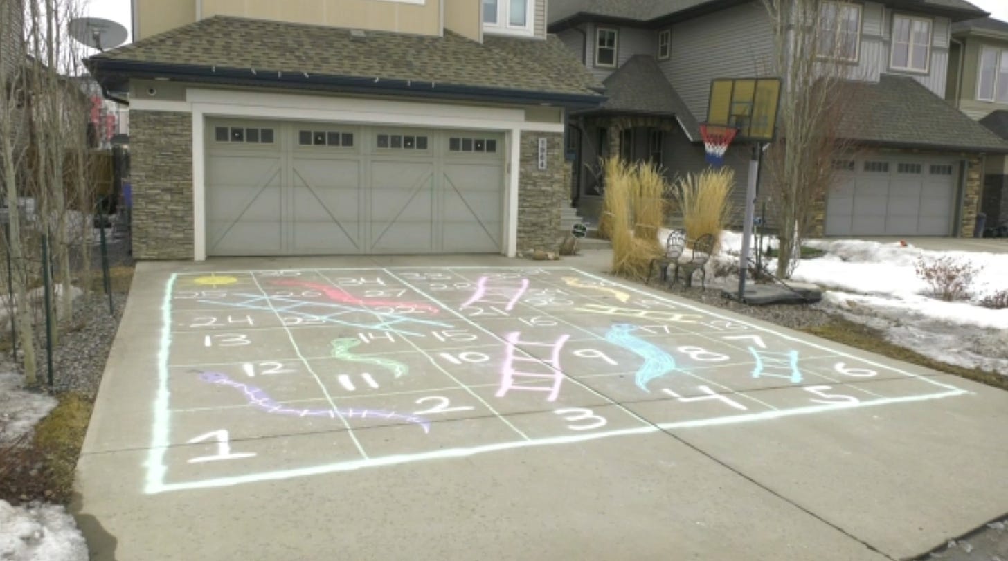 Giant snakes and ladders game drawn on Edmonton driveway | CTV News