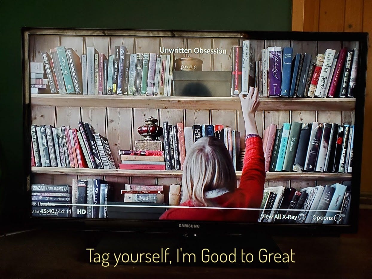 Holly reaching for a book on a messy bookshelf, captioned "Tag yourself, I'm Good to Great"