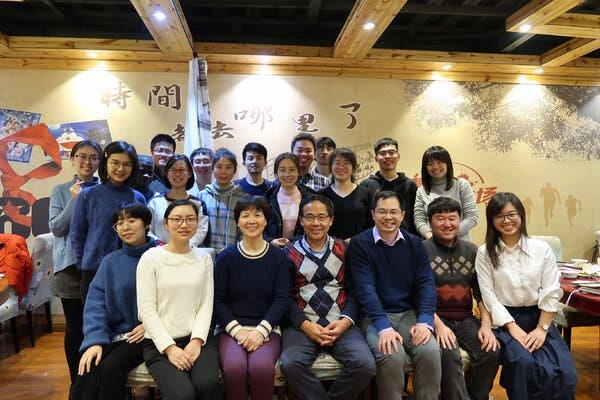 Dr. Shi, third from left in the front row, with her fellow virologist Wang Linfa, fourth from left, and colleagues from the Wuhan Institute of Virology at a Wuhan restaurant on Jan. 15, 2020. The outbreak had just emerged and the team were working hard to understand the new virus.