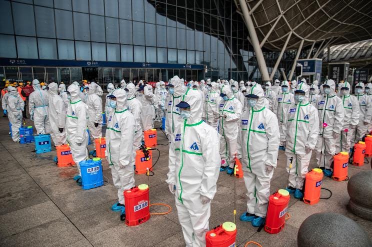 Staffers prepare to disinfect the rail station in Wuhan, China, the city where COVID originated. The Chinese government covered up its role in COVID's beginnings -- much as it did during the Asian flu, the Hong Kong flu and SARS.
