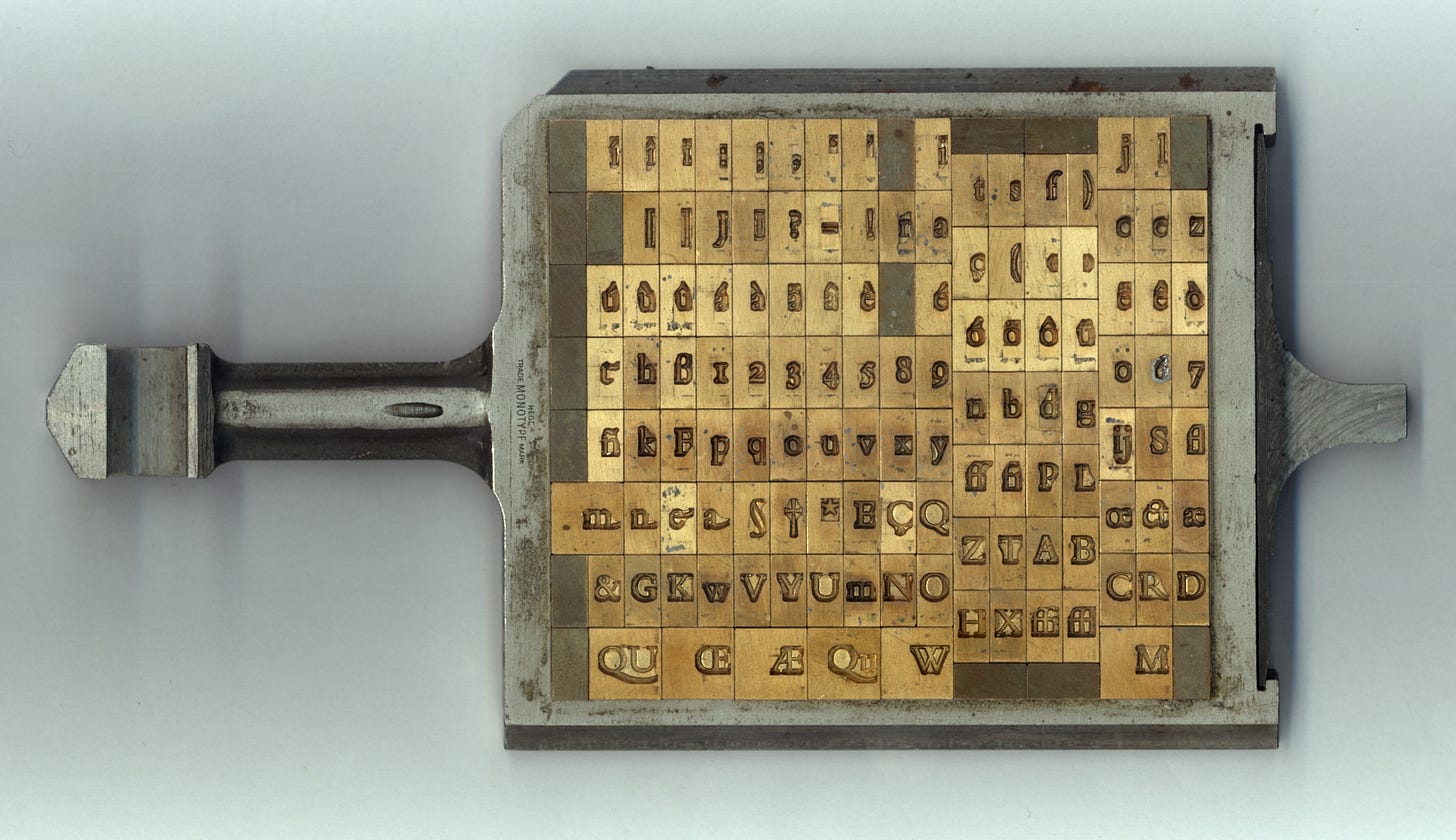 A composition case loaded with matrices for a font, used to cast metal type on a Monotype composition casting machine in the hot metal typesetting