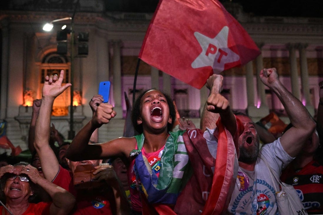 Supporters of Luiz Inacio Lula da Silva celebrate after their candidate won the presidential run-off election, in Rio de Janeiro, Brazil on Sunday. Photo: AFP