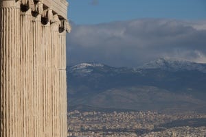 Athens and hills seen beyond Erechtheion colonnade.jpg
