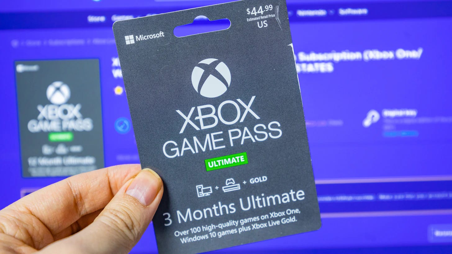 Matt Swider holding an Xbox Game Pass Ultimate membership