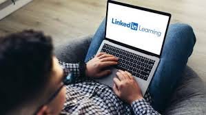 Person browsing LinkedIn Learning on a laptop