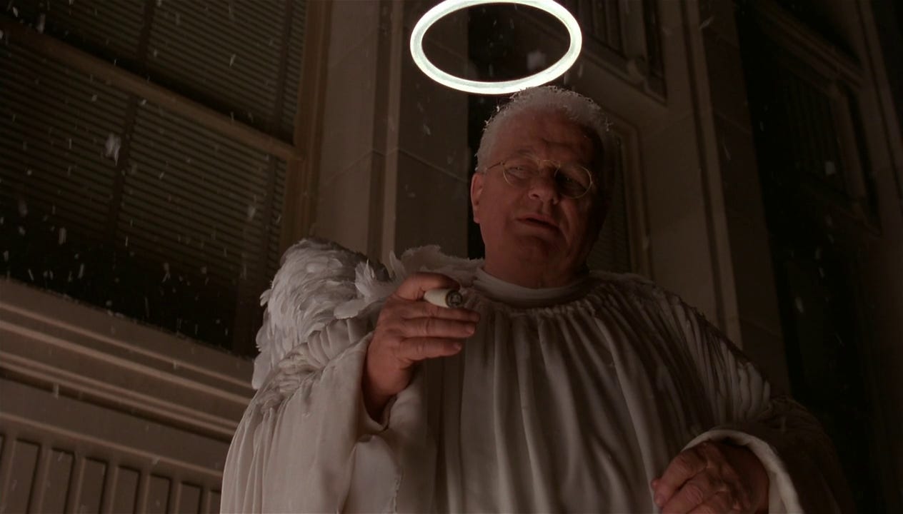 Charles Durning as the angel of Waring Hudsucker in a white robe with wings, a halo, and a cigar
