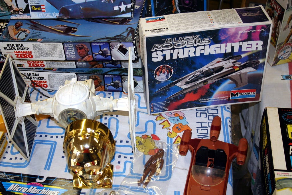 "TIE Fighter, Buck Rogers Starfighter, C3PO head, and Landspeeder" by skpy is licensed under CC BY-SA 2.0