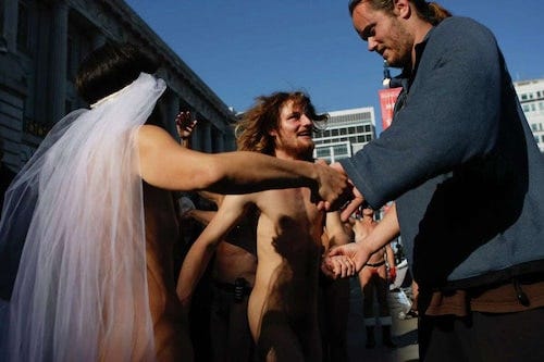 Here is accused Paul Pelosi attacker and Green Party member David DePape (right) dancing at the nudist wedding of his friends in San Francisco circa 2013 .