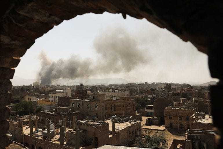 Smoke rises after Saudi-led air raid on an army base in Sanaa on March 7, 2021 [Khaled Abdullah/Reuters]