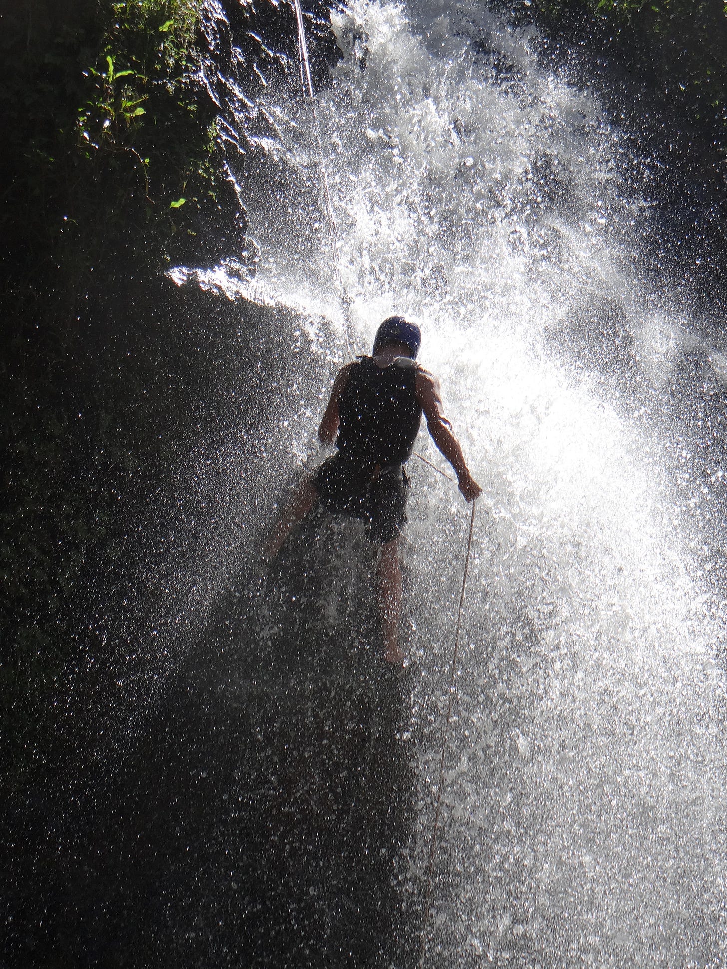 Abseiling down the waterfall