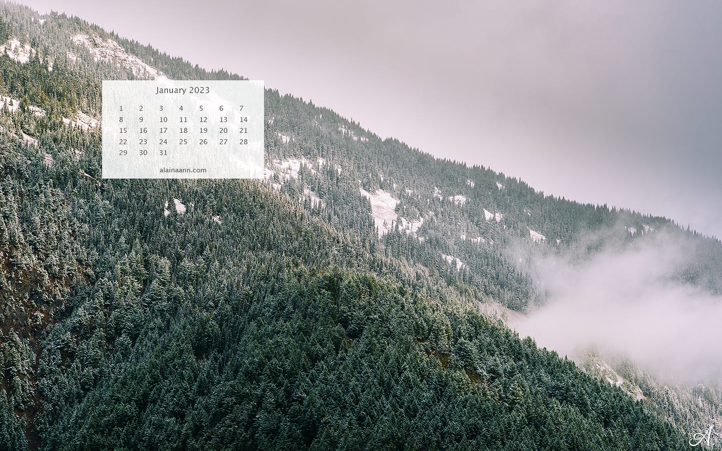 Photo of a snow covered mountainside with a January 2023 calendar overlayed in the upper left corner.