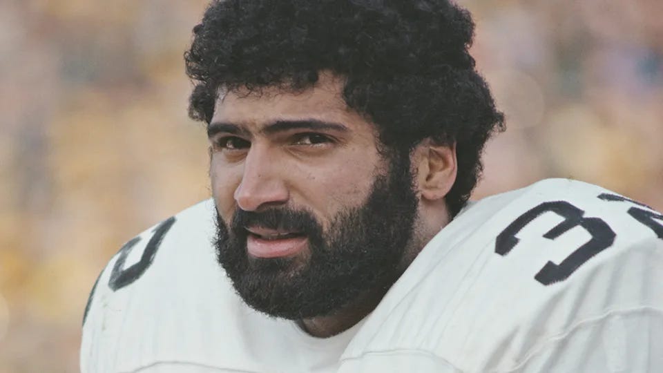 Franco Harris, Pittsburgh Steelers running back, during the NFL/AFC Divisional playoff game on Dec. 19, 1976 at Memorial Stadium in Baltimore. The Steelers won, 40-14. / Credit: Photo by Bob Grieser/Allsport/Getty Images