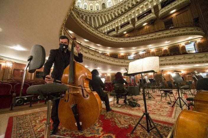 Despite the disinfectant, social-distancing and staff taking people's temperature, a festive spirit reigns at the historic opera house in the Bulgarian capital Sofia