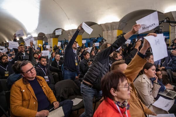 Journalists held up signs listing the name of their media outlets to be called on to ask questions of President Volodymyr Zelensky of Ukraine during a news conference in Kyiv in April.