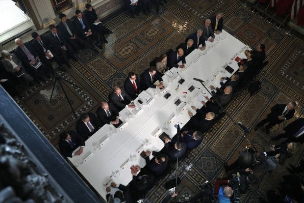 U.S. Trade Representative Robert Lighthizer leaning across the table from Chinese Vice Premier Liu He, as senior U.S. and Chinese officials resumed trade negotiations in Washington in February.