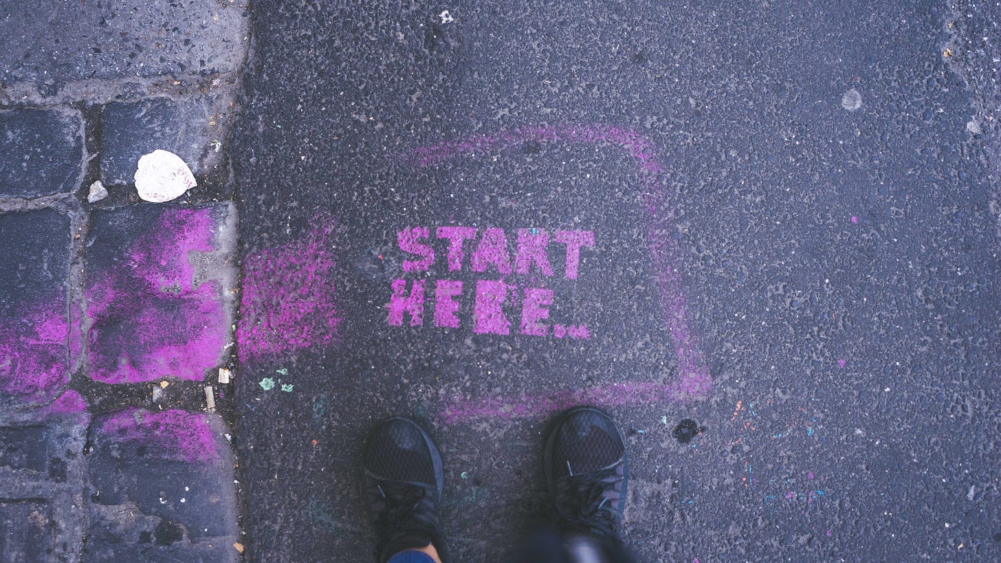Start here painted on road