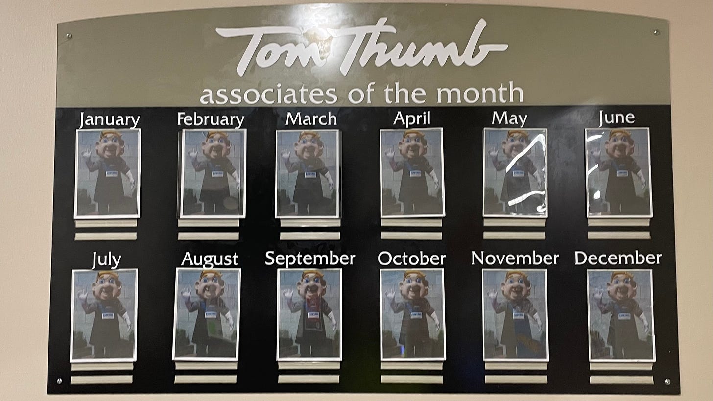 A 12-month display of "associates of the month" at Tom Thumb that shows 12 pictures of the grocery store's mascot