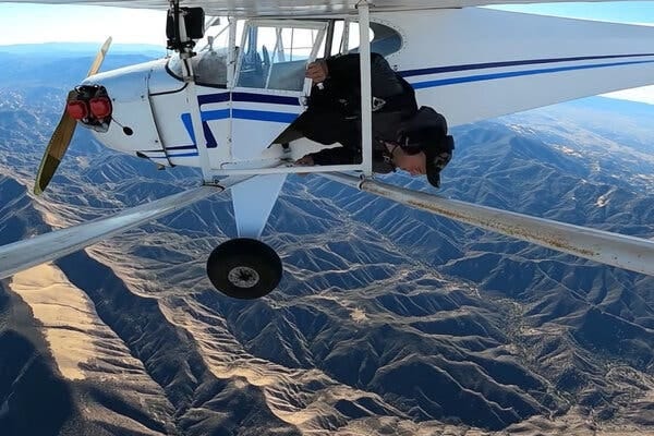 A still frame from Trevor Jacob’s YouTube video, “I Crashed My Plane,” showing him exiting the plane.