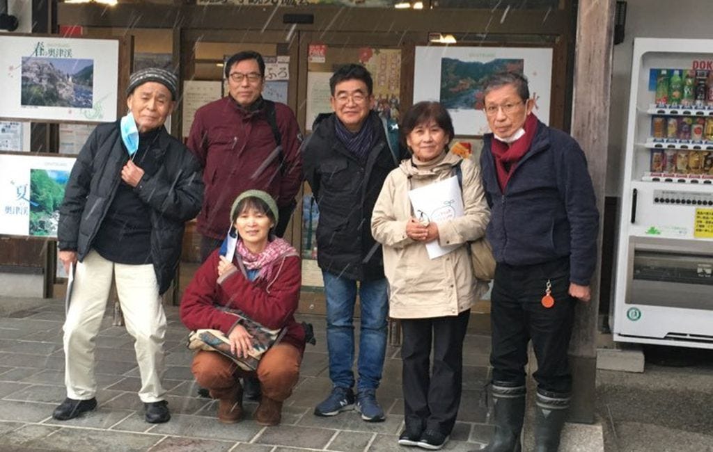 (Courtesy of Tomoyo Tamayama) Activists pose for a photo before their visit to a Japan Atomic Energy Agency site in southern Japan that plans to ship radioactive material to Utah for processing. Tomoyo Tamayama (below)  researched the legacy of uranium mining on the Navajo Nation in two postgraduate programs.