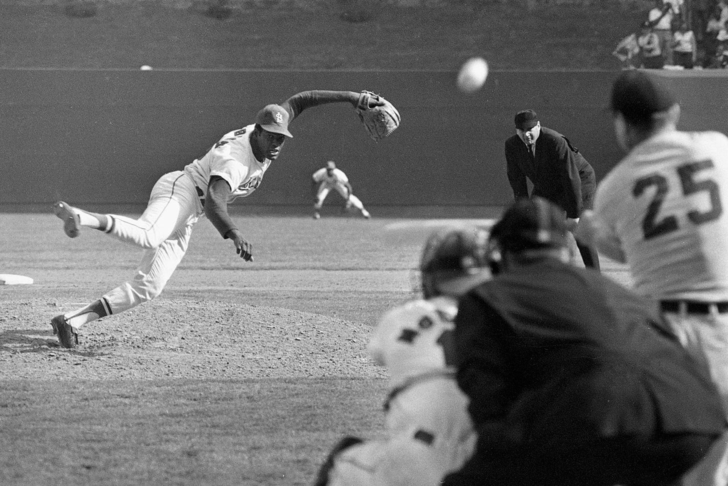 Bob Gibson pitching during the ninth inning of the first game of the 1968 World Series at Busch Stadium in St. Louis...