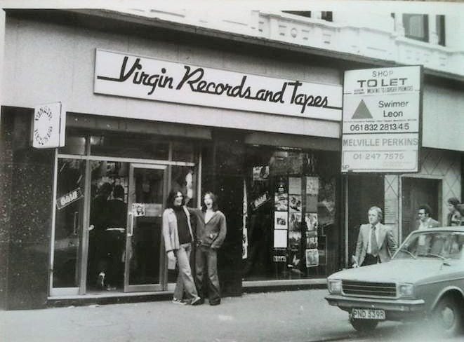 Arthur on Twitter: &quot;Virgin Records shop, 9 Lever Street, Manchester, 1978.  Then became a megastore on Market Street. John Cooper Clarke Disguise In  Love LP in the window. Photo via British Record