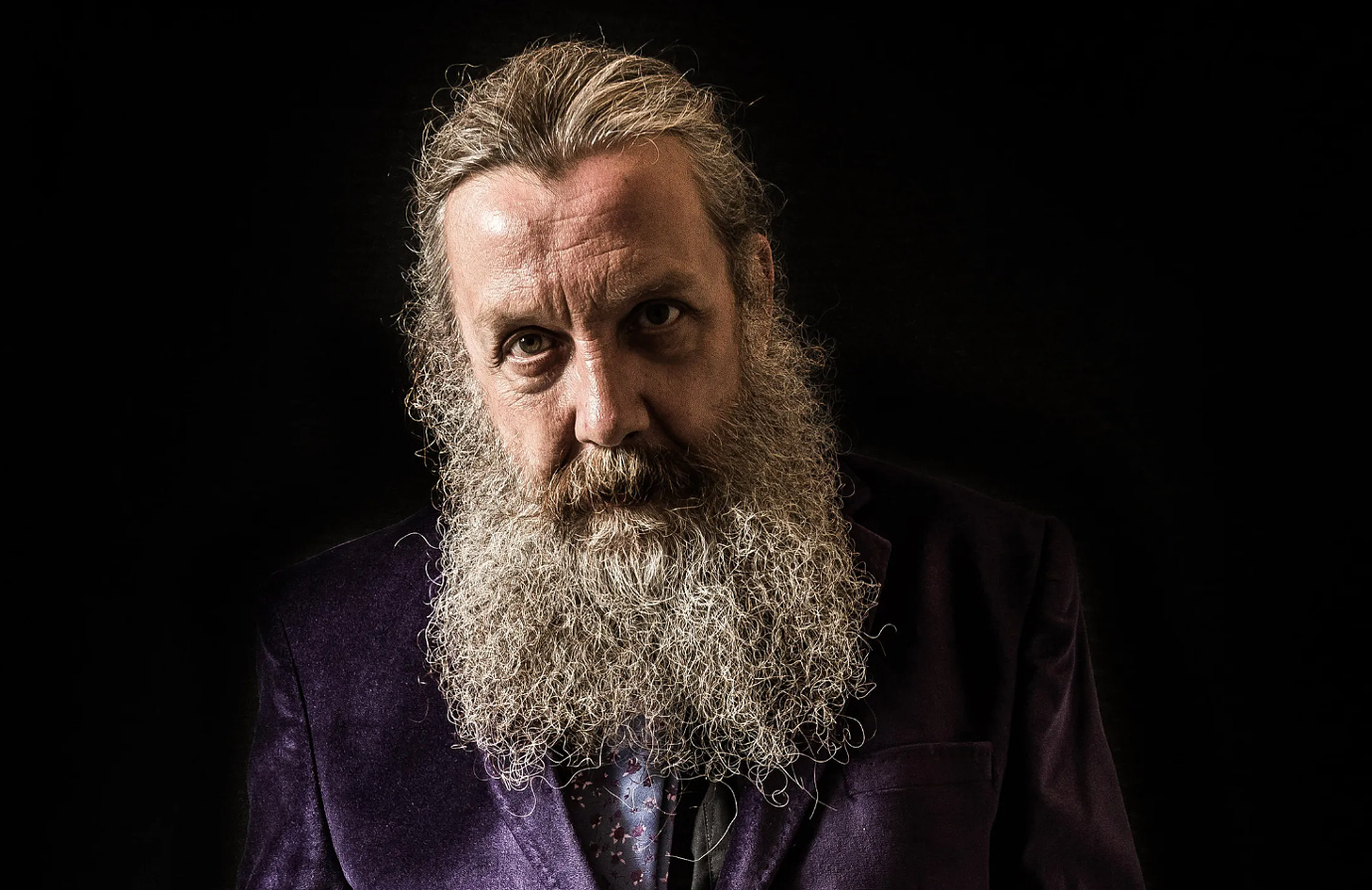 Alan Moore with his giant white beard and intense stare