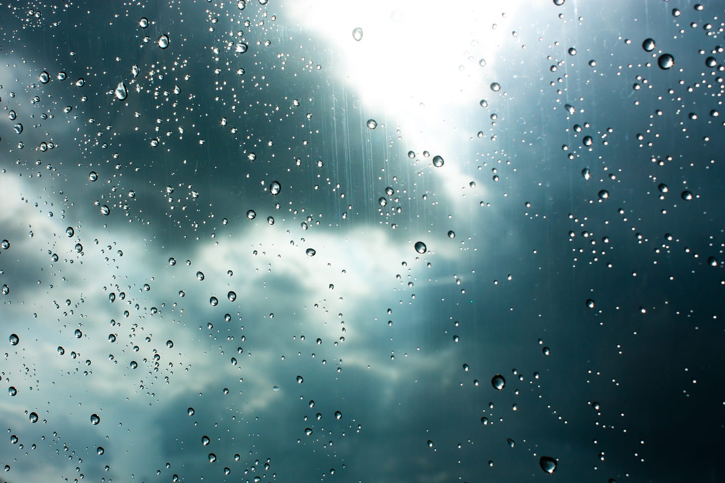 Drops of rain on glass , rain drops on clear window