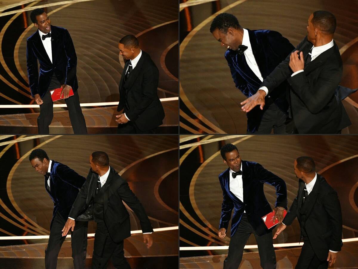 Will Smith approaches and slaps Chris Rock onstage during the 94th Oscars at the Dolby Theatre in Hollywood on March 27. (Robyn Beck/AFP)