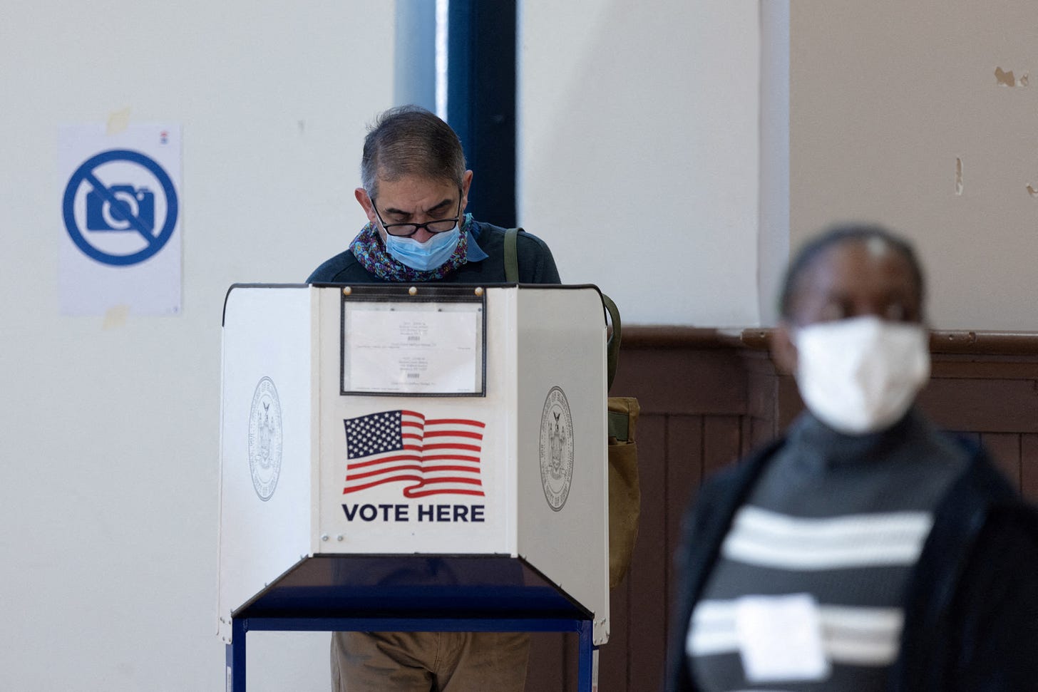 Voters cast their ballots at a polling station during early voting in New York City