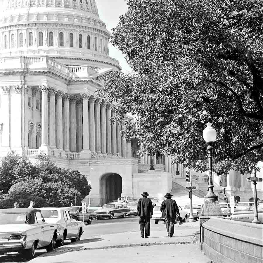 Black and white film image of two Amish men walking in Washington D.C.