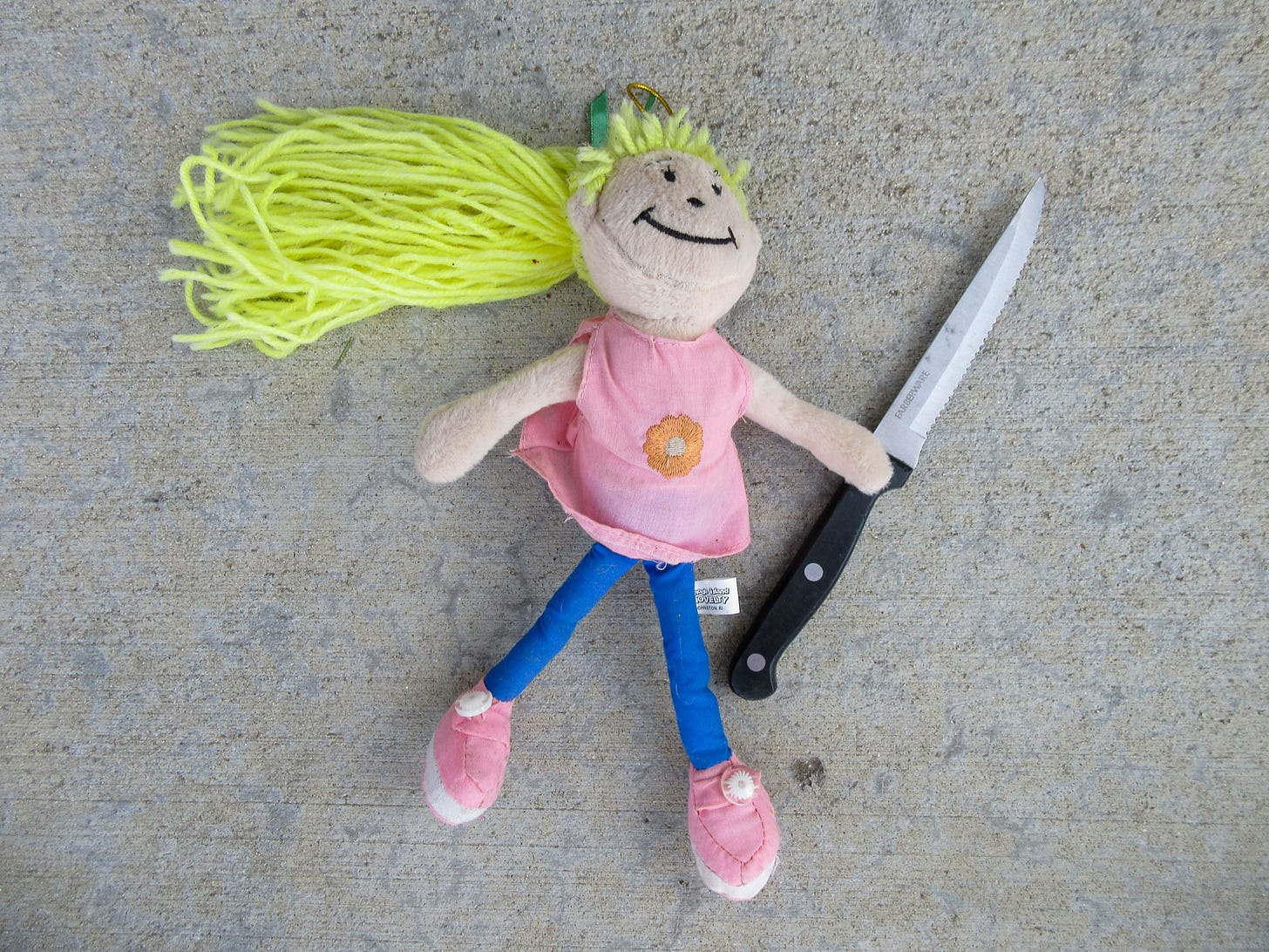 stuffed doll with knife