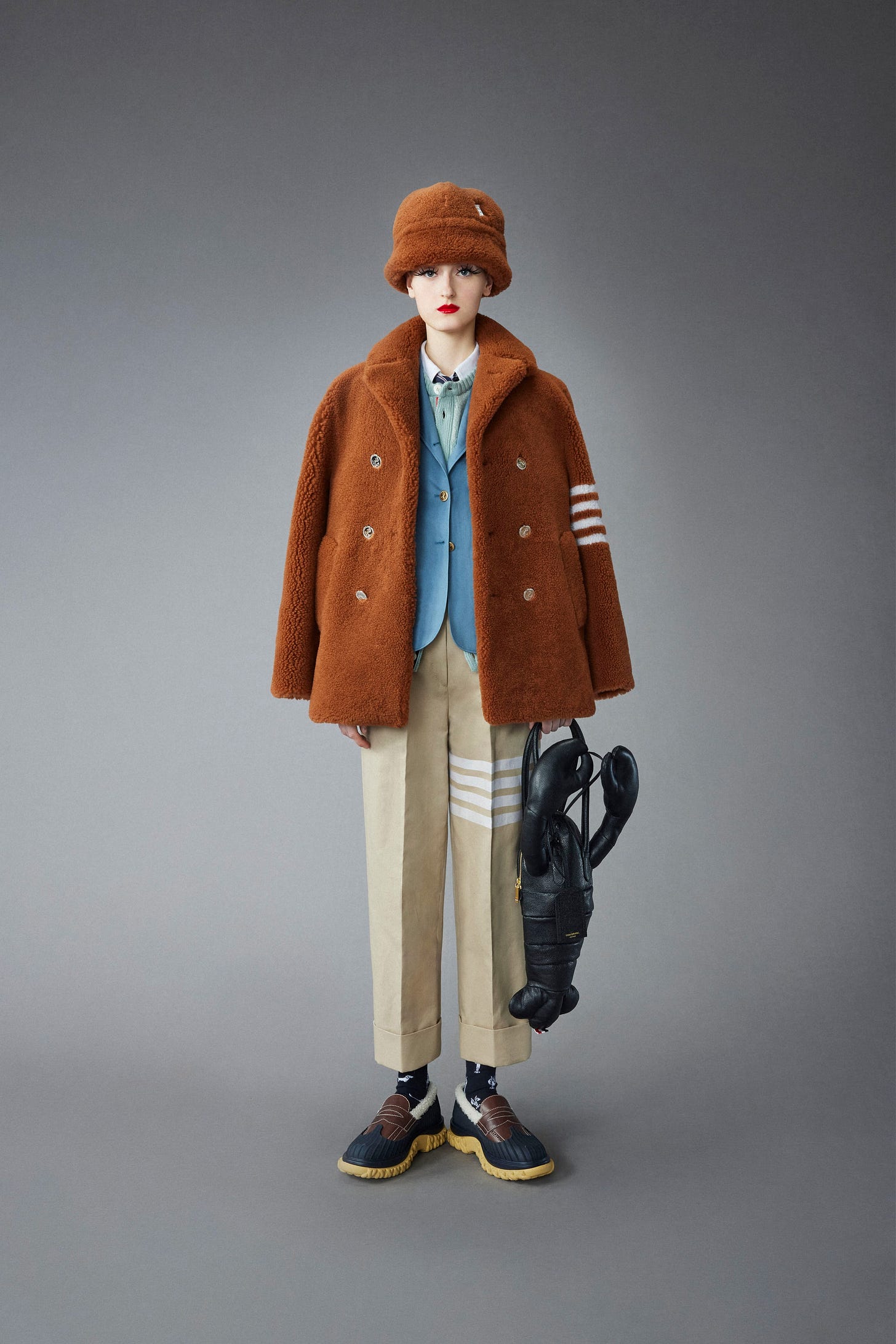 Image may contain Coat Clothing Apparel Human Person Doll Toy and Overcoat