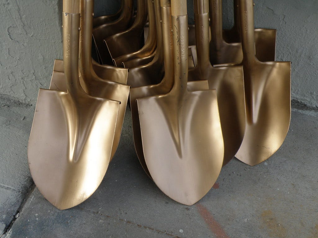 A stack of shiny golden shovels. "Golden Shovels" by lavocado@sbcglobal.net is marked with CC BY 2.0.