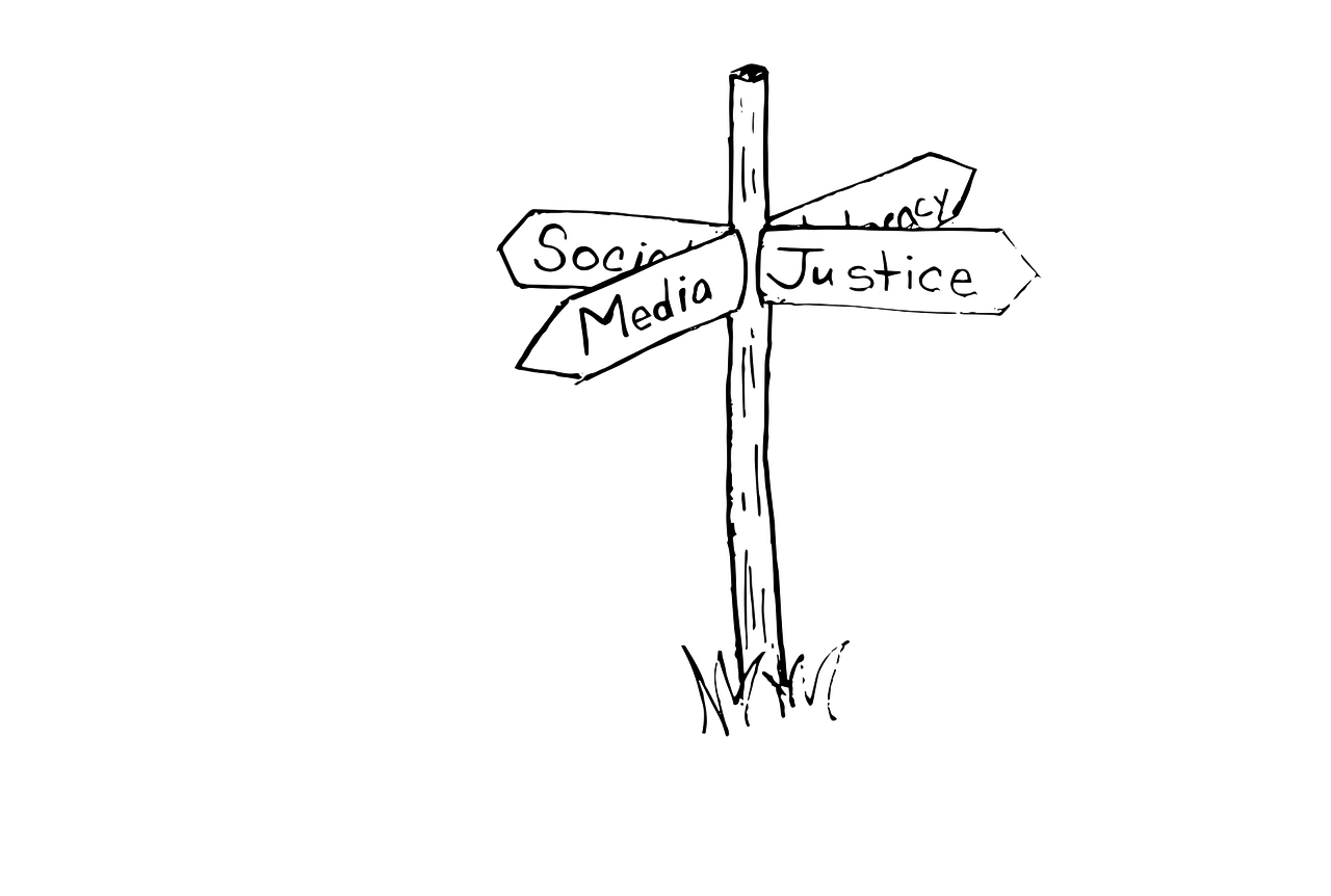 social, media, justice, unreadable word on sketched direction pole
