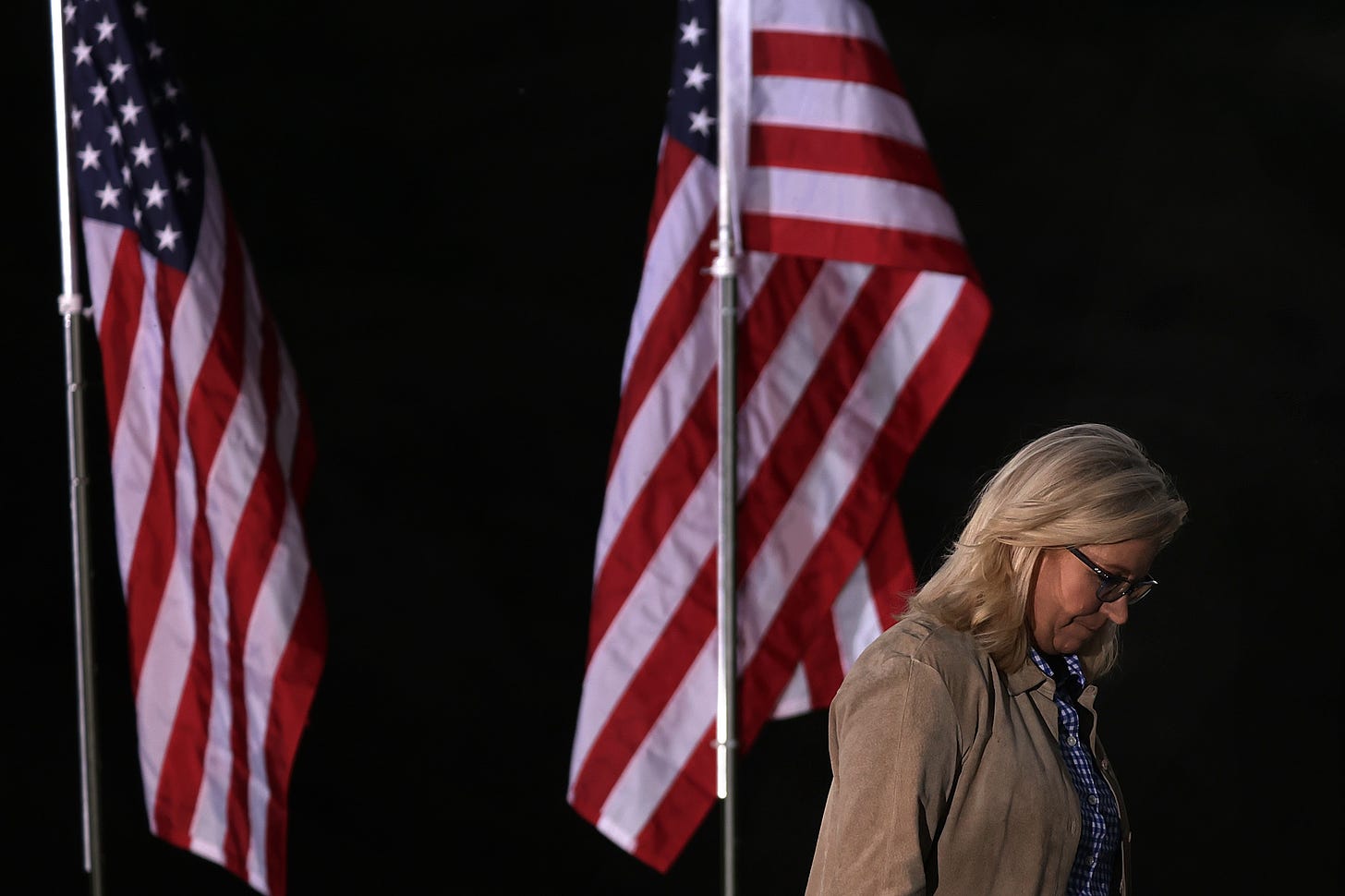Rep. Liz Cheney departs after speaking to supporters during a primary night event.