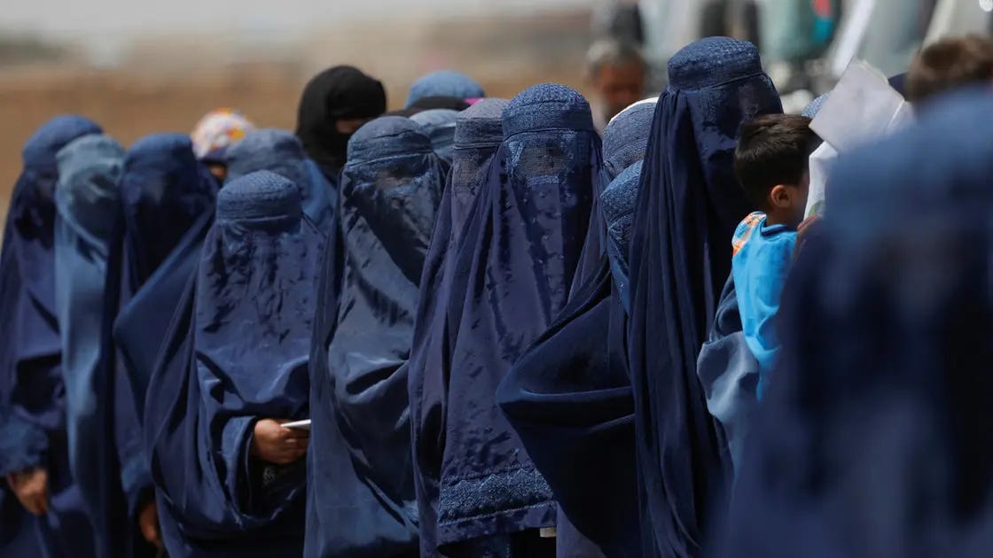 A group of people in blue robes

Description automatically generated with low confidence