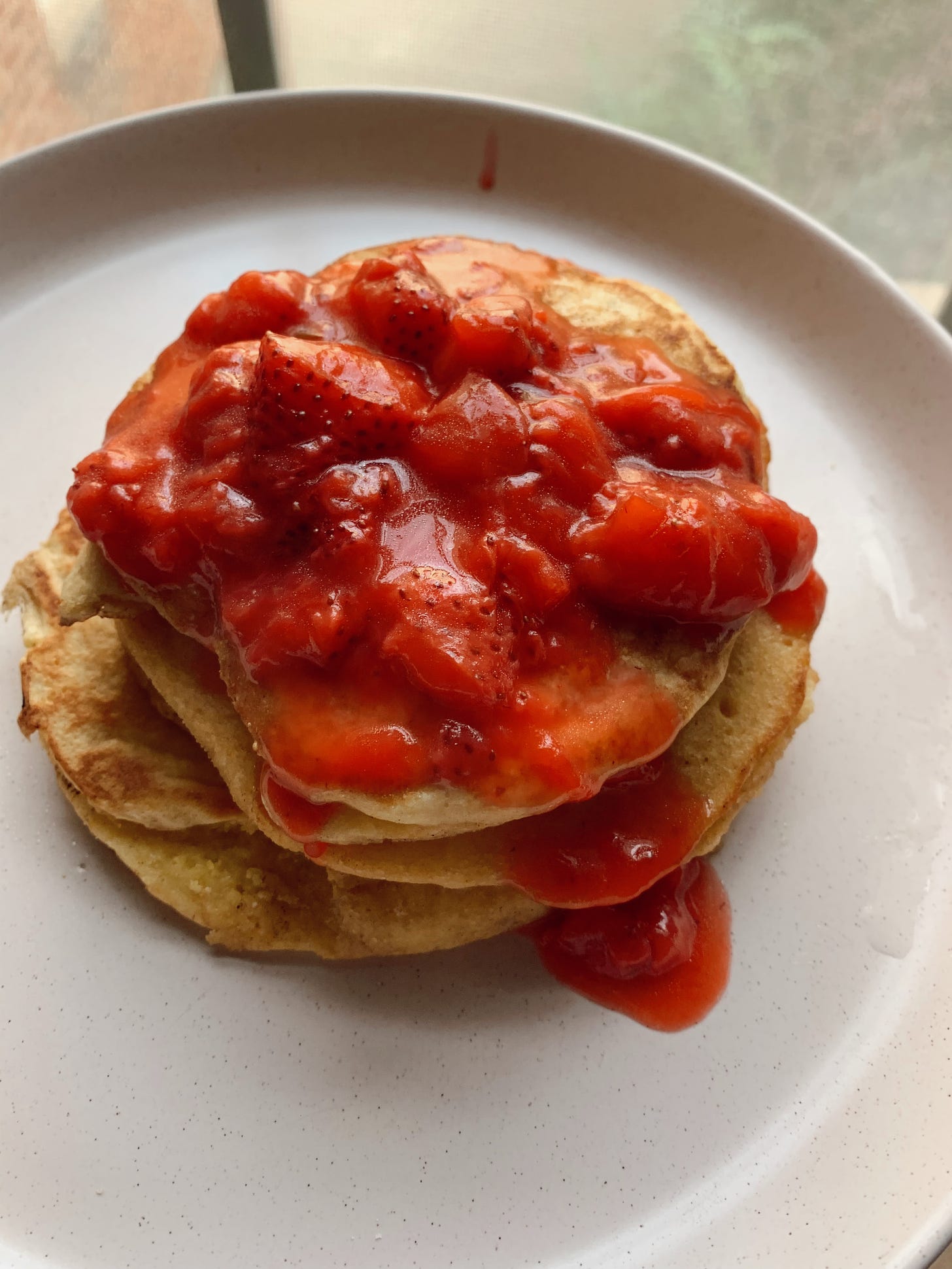 pancake stack with strawberry compote on top