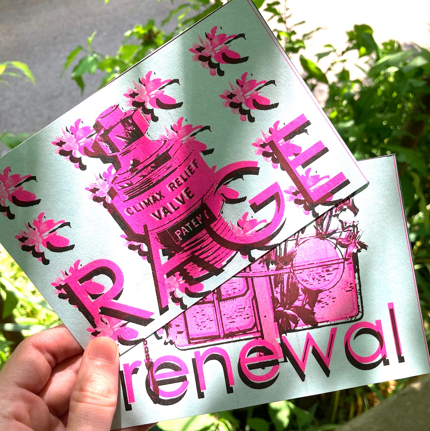Two postcards held in the sun. Both are blue background with neon pink and black ink. RAGE is on top, with flowers and a "climax relief valve." Renewal, less visible, underneath.