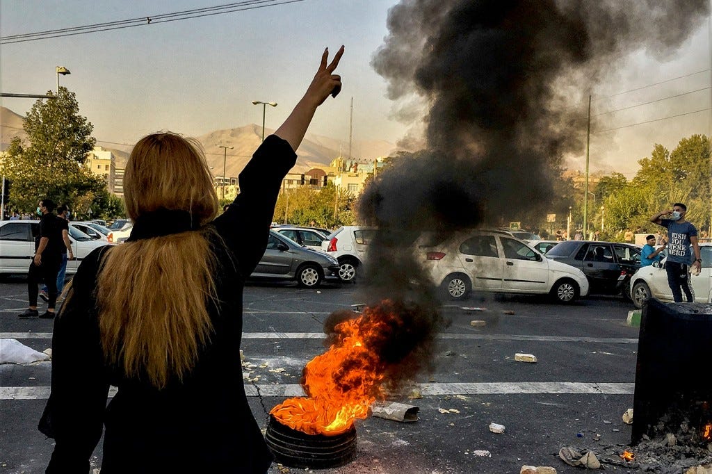 Iranians protest the death of 22-year-old Mahsa Amini in Tehran.