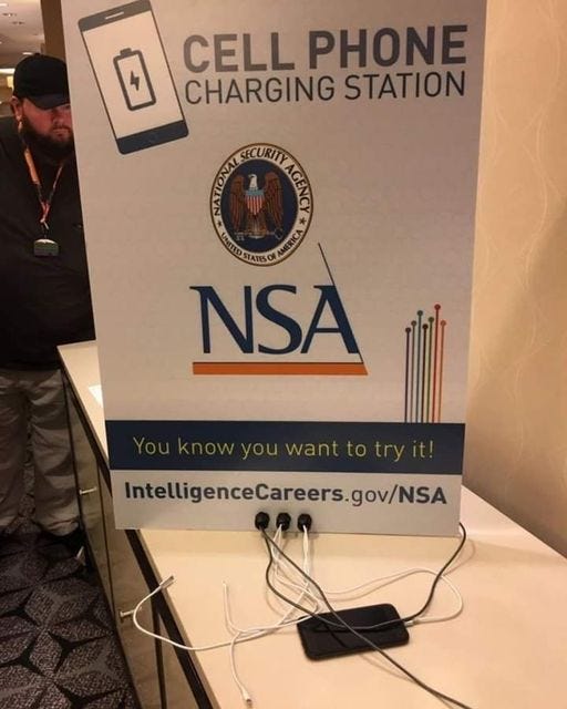 May be an image of 1 person and text that says 'CELL PHONE CHARGING STATION TONMI NSA IntelligenceCareers.gov/NSA'