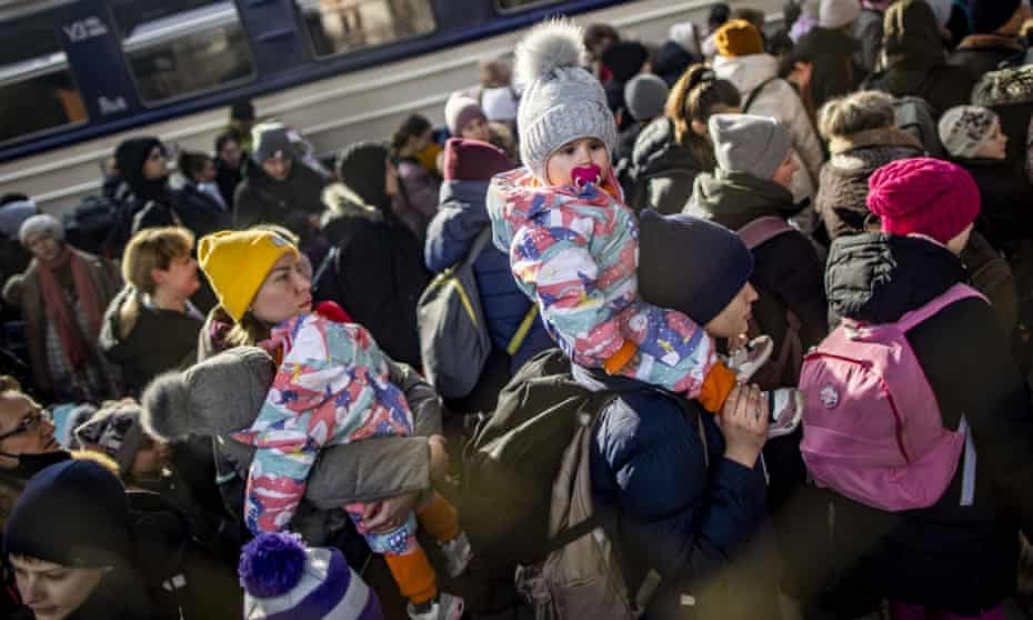 Hundreds of people fleeing the Russian invasion of Ukraine arrive in Przemysl, Poland, by train, 1 March 2022.