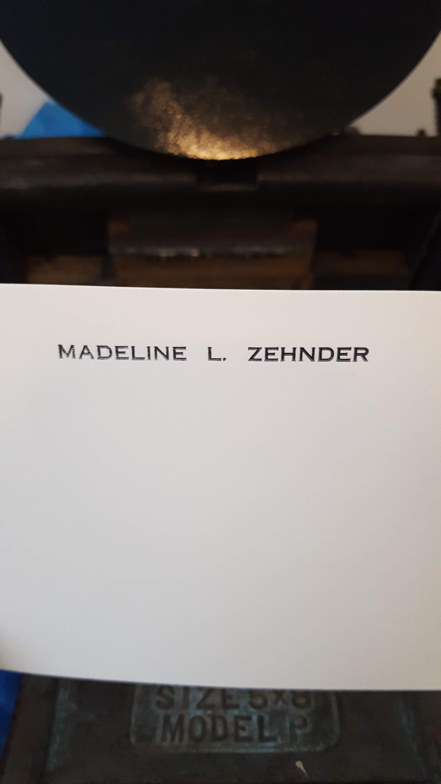 Printed card that reads "MADELINE L. ZEHNDER" in black type on white paper