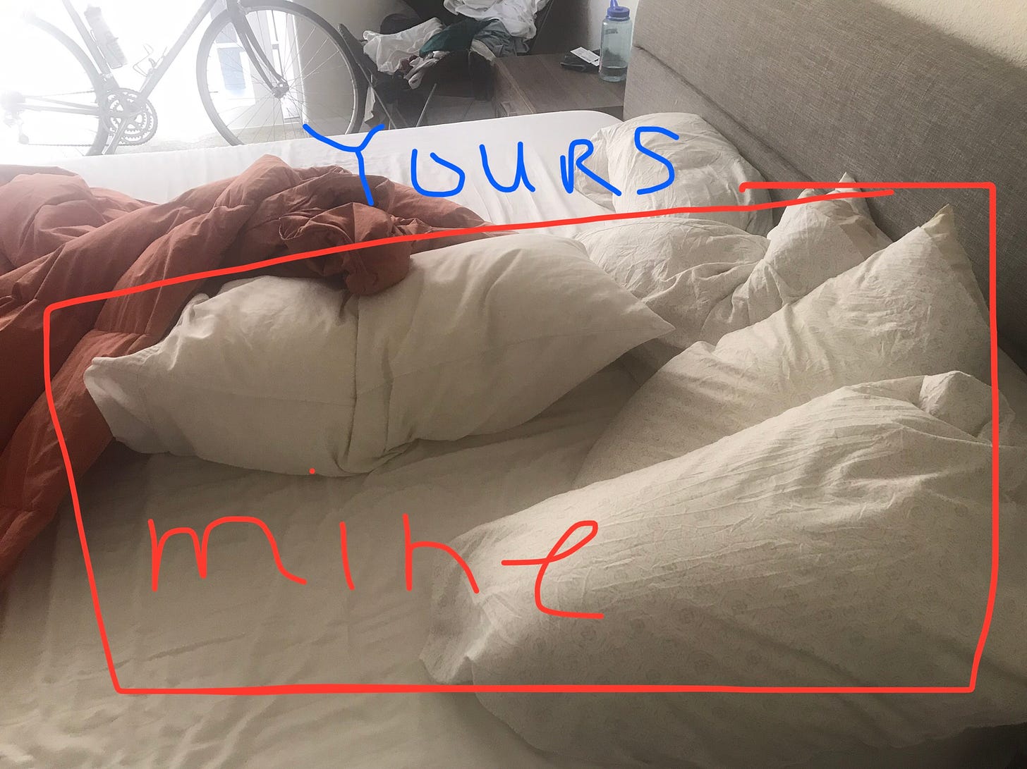 photo of the bed with one side piled with pillows, highlighted with a red box that says 'mine' and the other side of the bed with one pillow and the blue word 'yours'